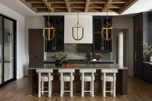 Tournu Lantern 16.25" in aged brass styled in an entry hallway for warm, layered light at Laurie Yapp Home.