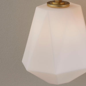 Tring Wall Sconce in aged brass shown from the front to reveal the arm curve and shade silhouette.