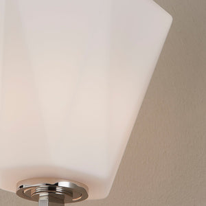 Close-up of the Tring Wall Sconce in polished nickel showing the arm curve and shade silhouette.