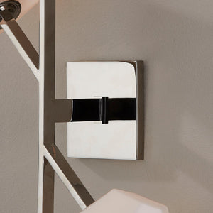 Close-up of the Tring Wall Sconce in polished nickel showing the arm curve and shade silhouette.