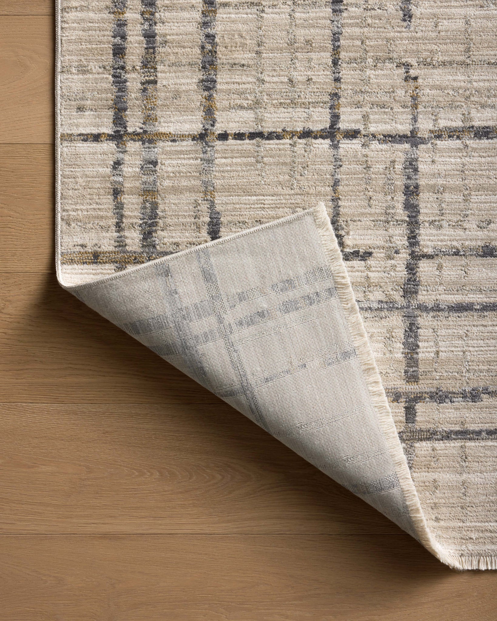 Wade Beige / Midnight shown from a different angle to reveal its pattern.