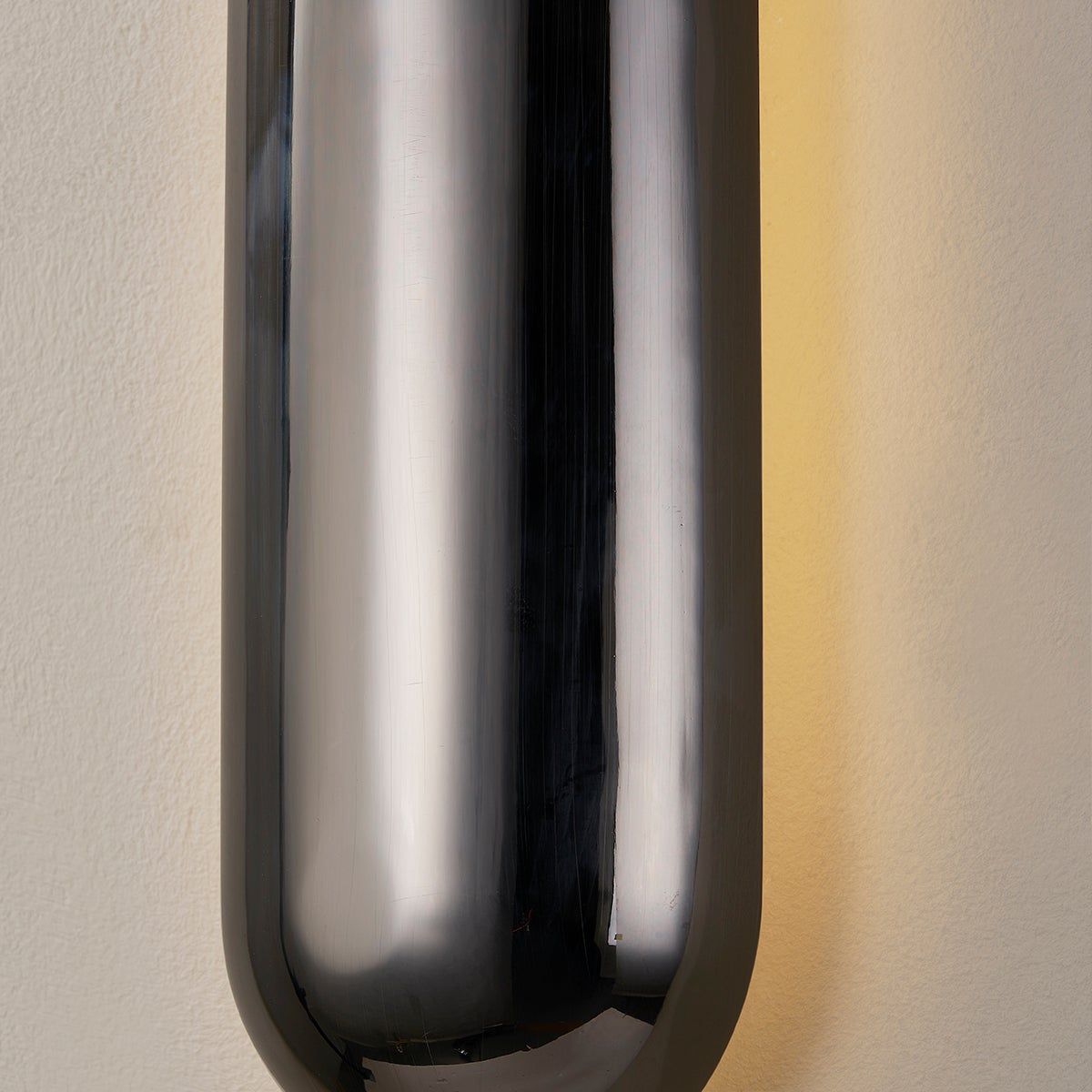Close-up of the Wheeler Wall Sconce showing the arm curve and shade silhouette.
