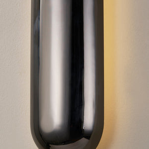 Close-up of the Wheeler Wall Sconce showing the arm curve and shade silhouette.