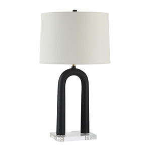 Pisa Table Lamp with black curved base and white fabric shade on a clear acrylic base.