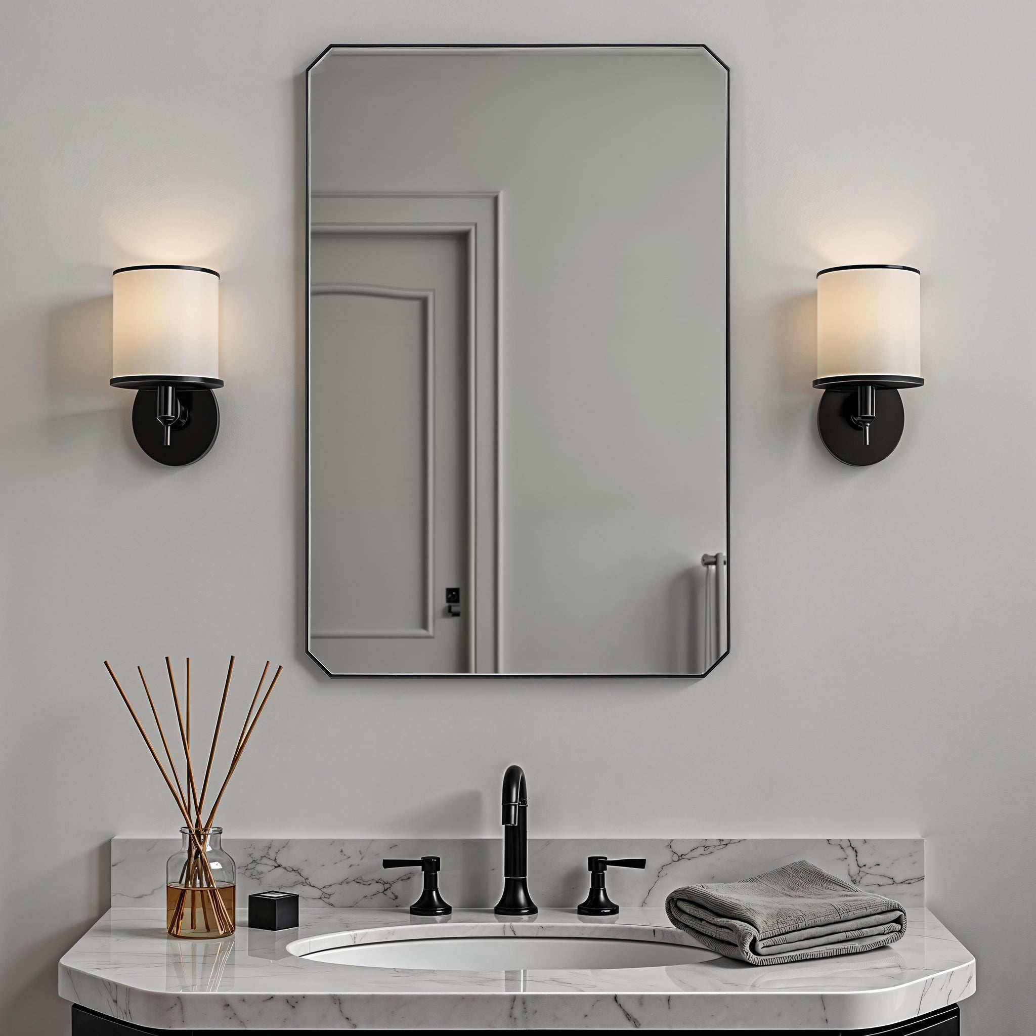 Jace mirror by Renwil in a modern bathroom setting above a marble sink.
