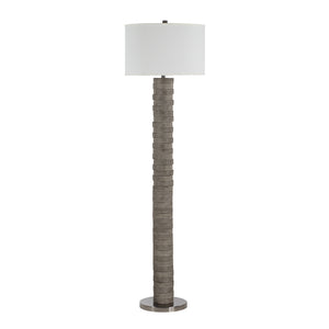 Moringa floor lamp with a textured gray base and white drum shade.