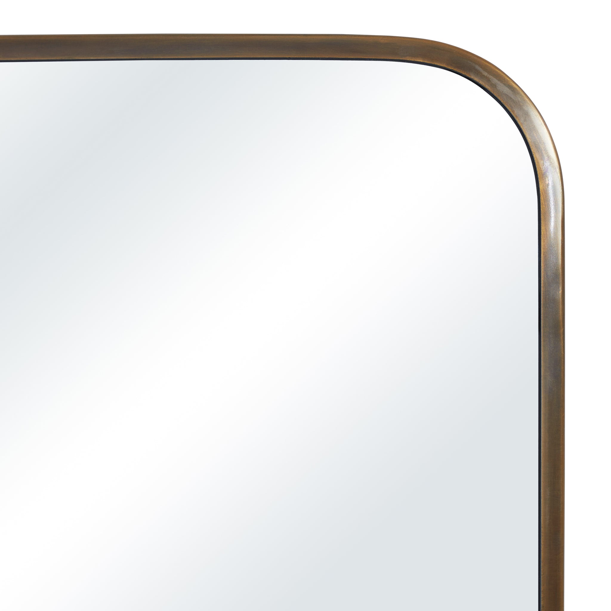 Close-up of the Jackline mirror's rounded bronze frame, highlighting the sleek design and reflective surface.
