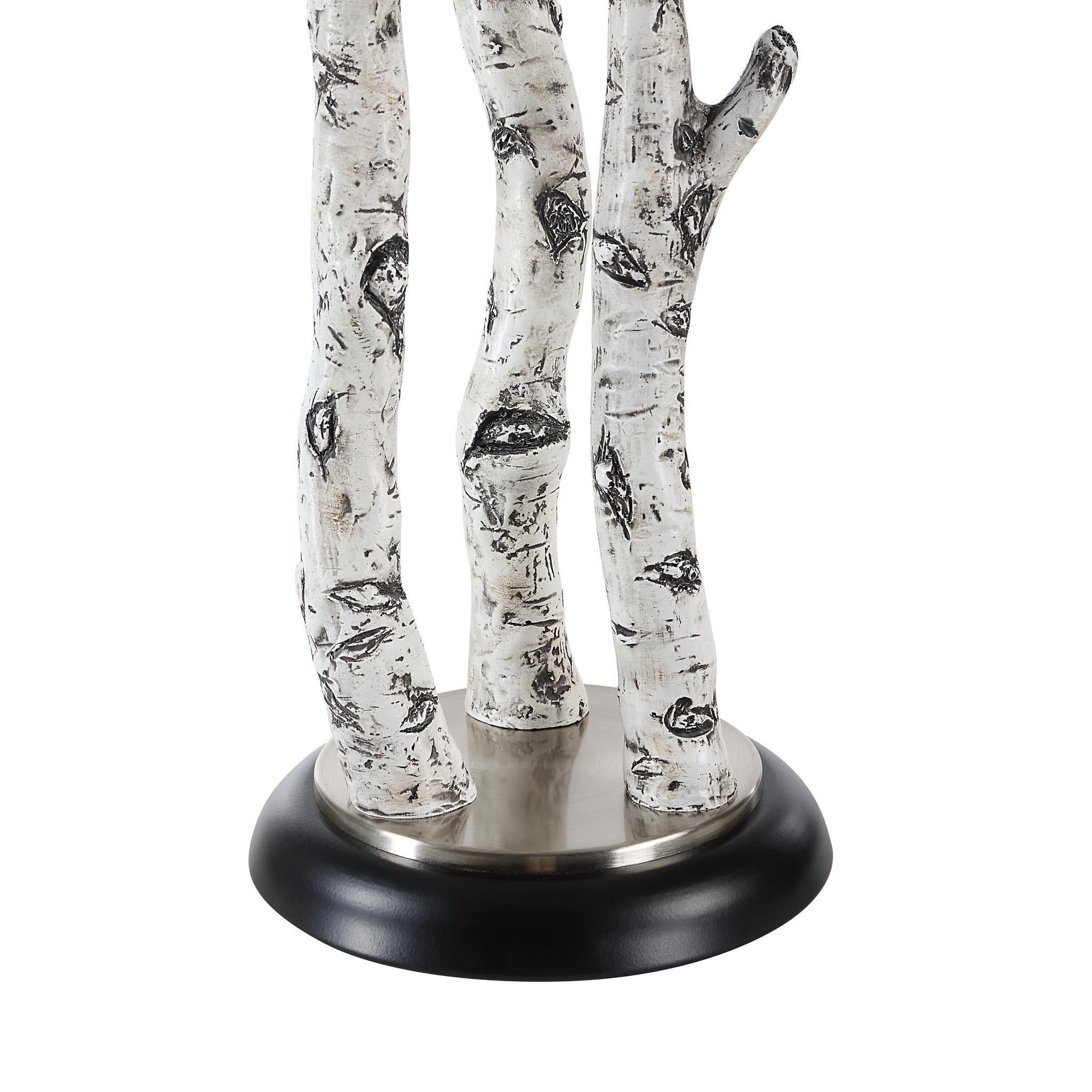 Close-up of Naousa Table Lamp's white branch base and black round base