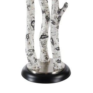 Close-up of Naousa Table Lamp's white branch base and black round base