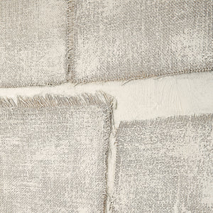 Close-up of Picardy canvas art highlighting the frayed edges of gray textured panels.