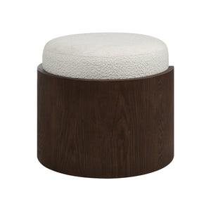 Capsula Ottoman with a round cream textured top and dark wood base