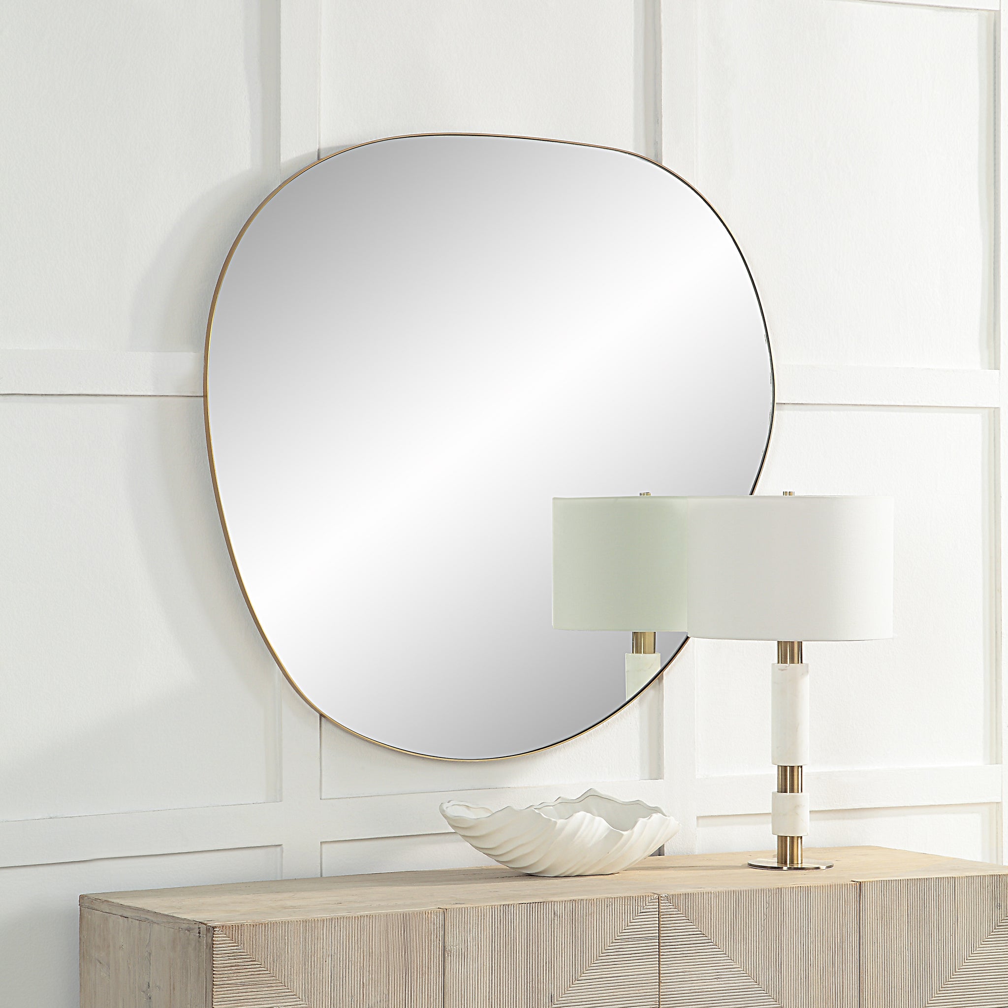 Peony Wall Mirror displayed above a wooden console, paired with a lamp and decorative bowl.
