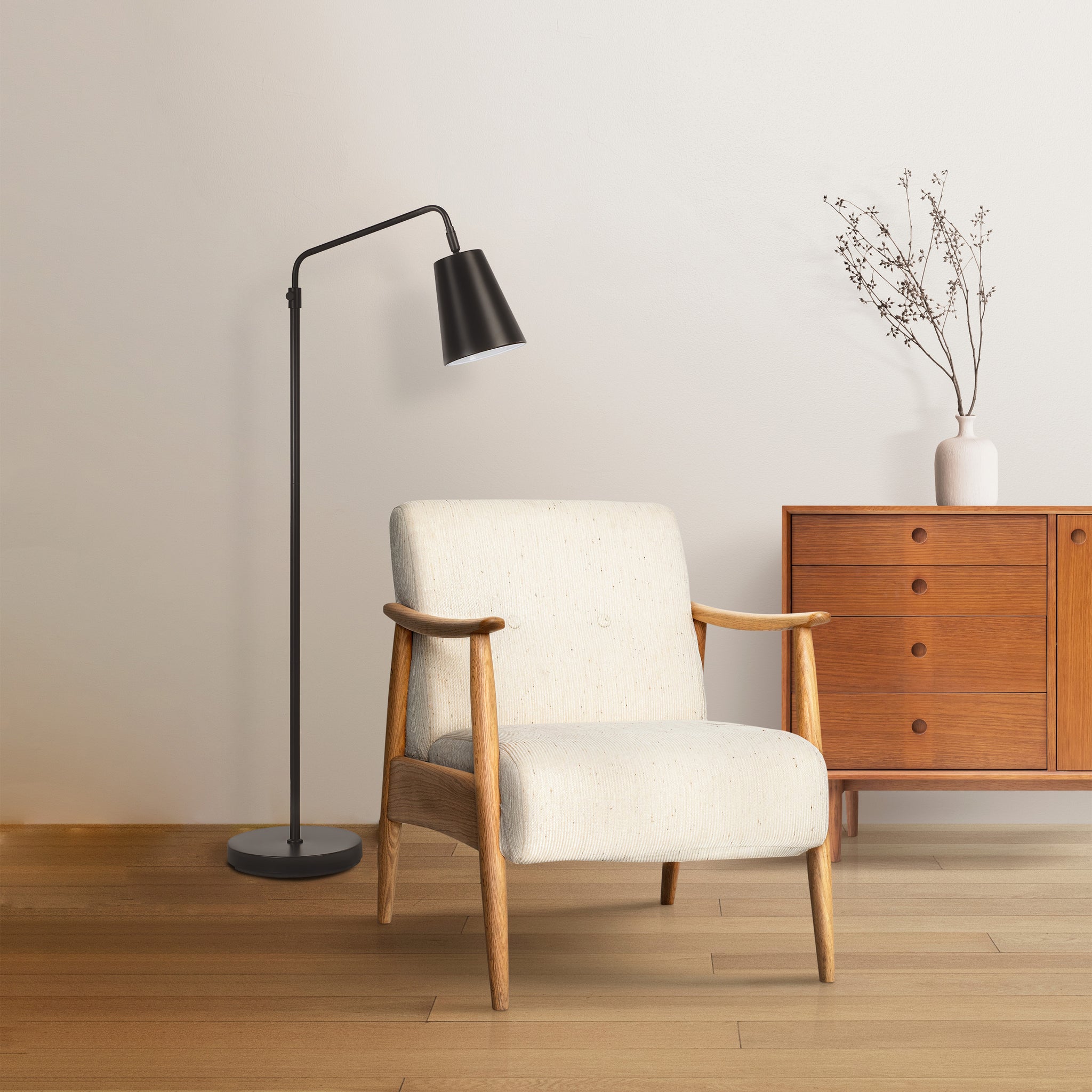 Nottingham floor lamp by Renwil beside a light-colored armchair in a modern setting