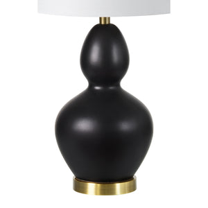 Kamilia Table Lamp showcasing a single black ceramic lamp with a white shade and brass base.