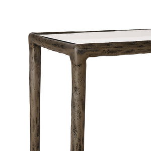 Nara console table featuring a white surface and bronze frame, close-up view of the corner.