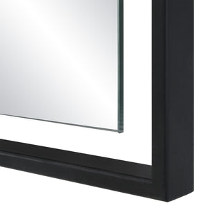 Close-up of Marco Wall Mirror's black frame and edge detail.