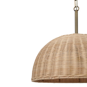 Ciara pendant light displaying a natural woven rattan shade with a brass hanging fixture.
