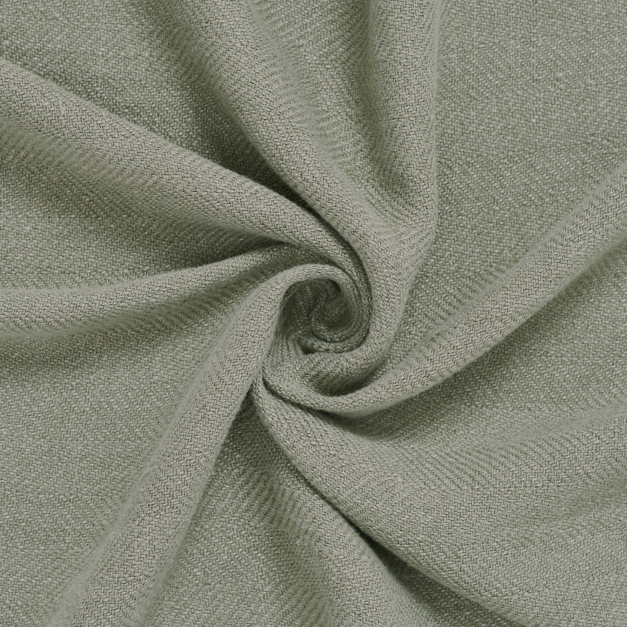 Vernier Throw in soft light green, displayed in a spiral to highlight its smooth texture.