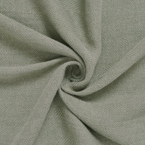 Vernier Throw in soft light green, displayed in a spiral to highlight its smooth texture.