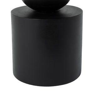 Paola Side Table with a cylindrical black base and smooth surface.