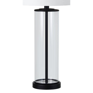 Desdemona Table Lamp with a clear glass base and white fabric shade, showcasing a modern design.