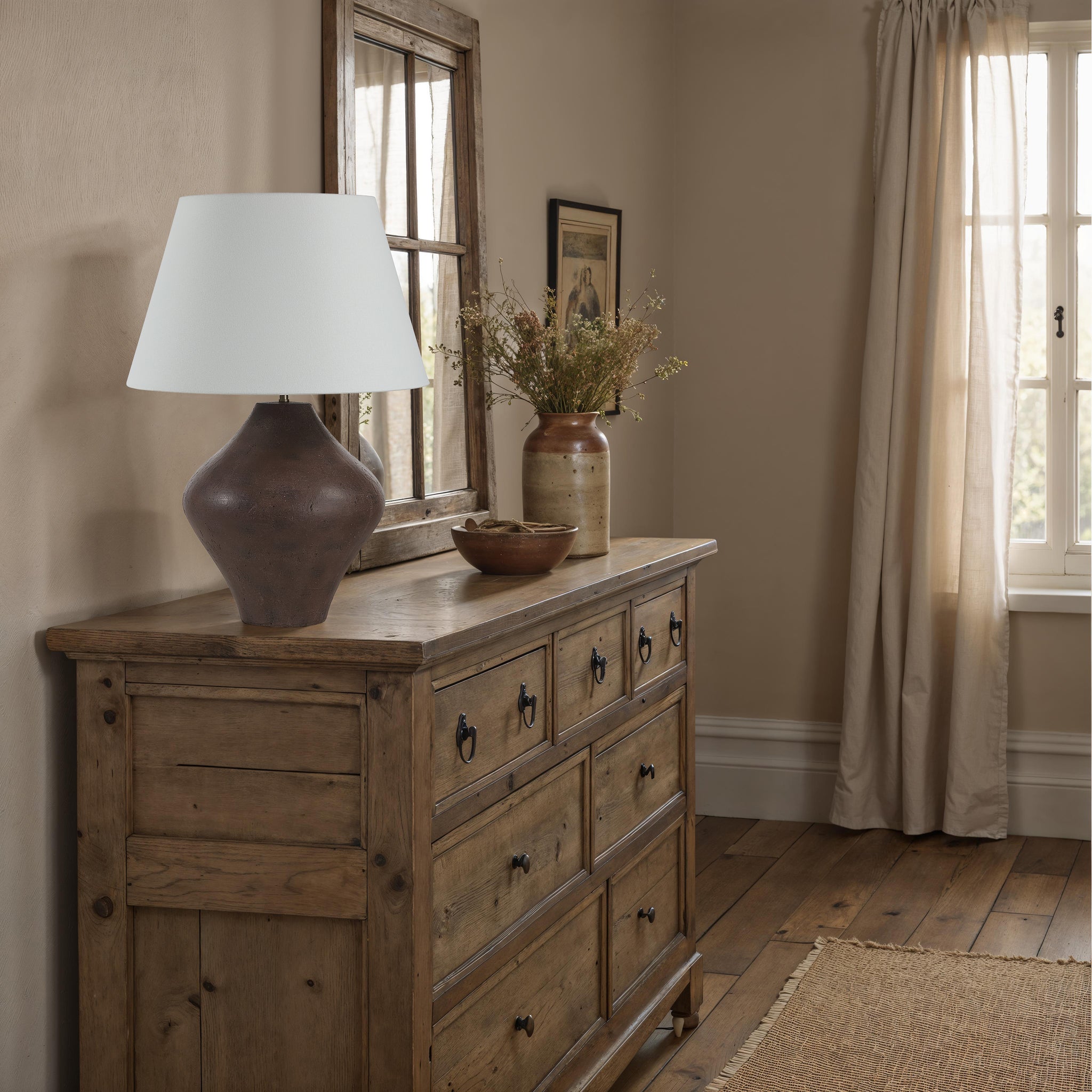 Pontia Table Lamp on a wooden dresser in a cozy interior setting