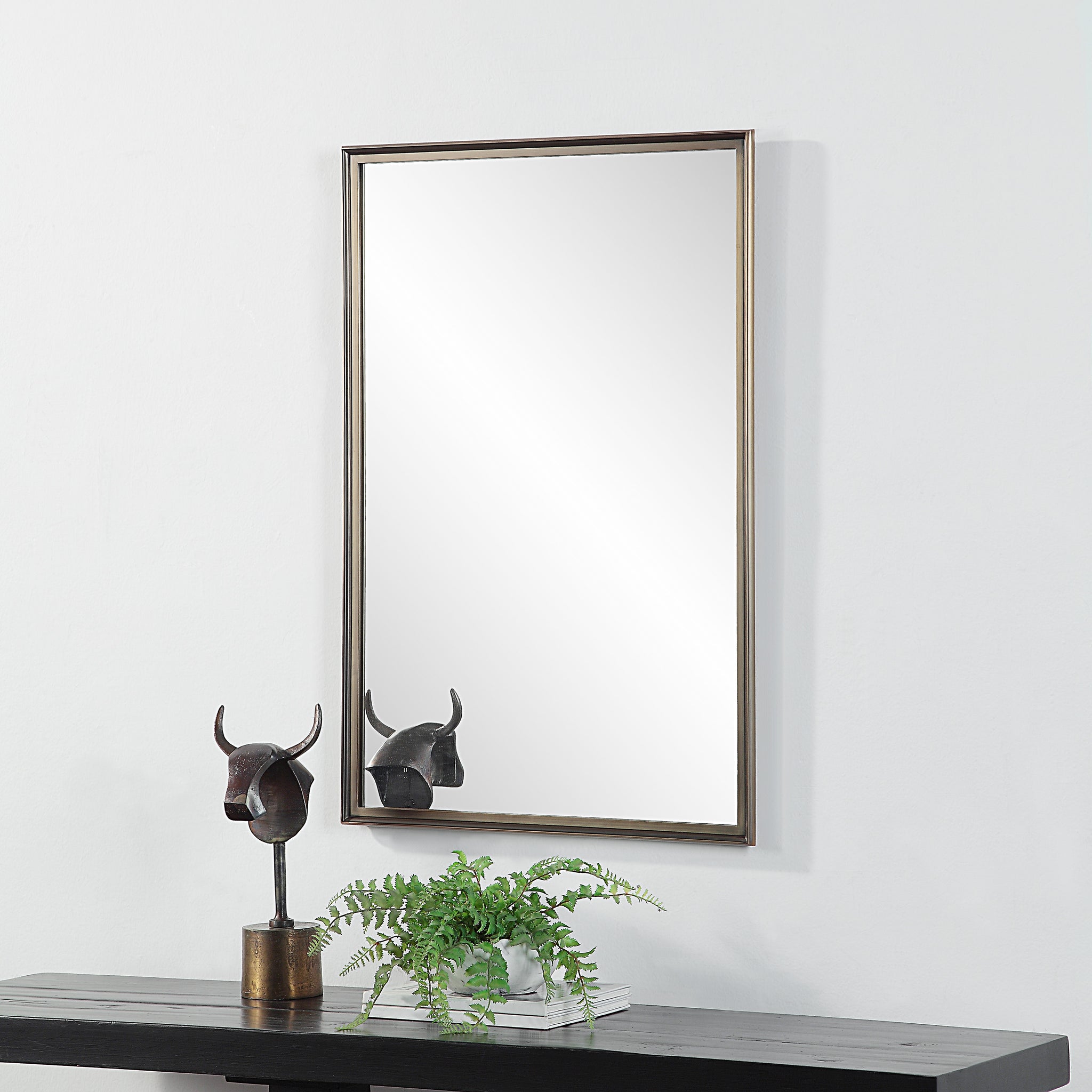 Sandcastle Wall Mirror displayed above a console table with decorative elements.