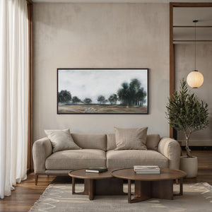 Westside canvas art featuring a serene landscape with trees, framed in dark wood.