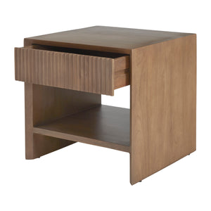 Jaime side table with a textured drawer front and open shelf, made of light wood.