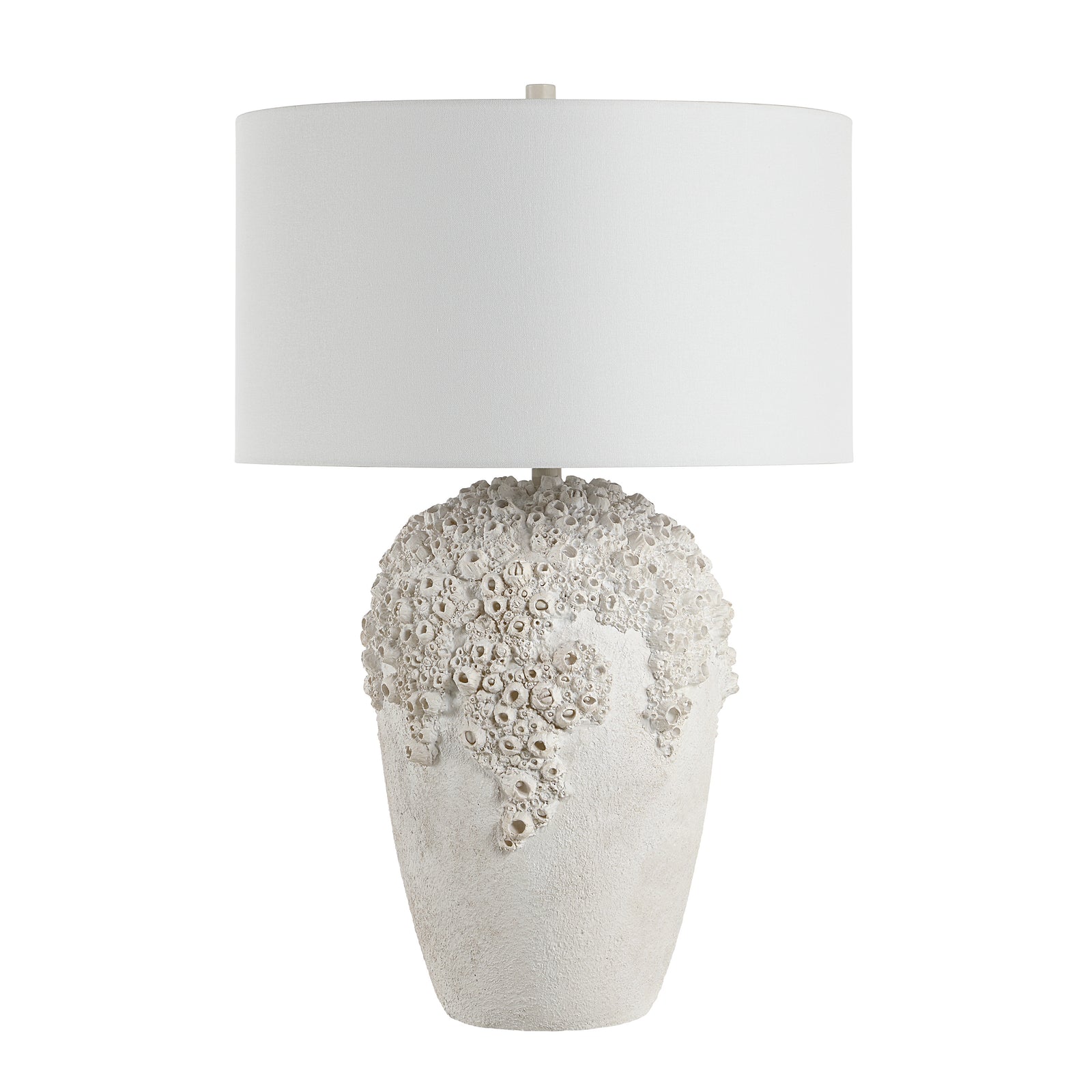 Wavy table lamp with a textured white base and a white fabric shade