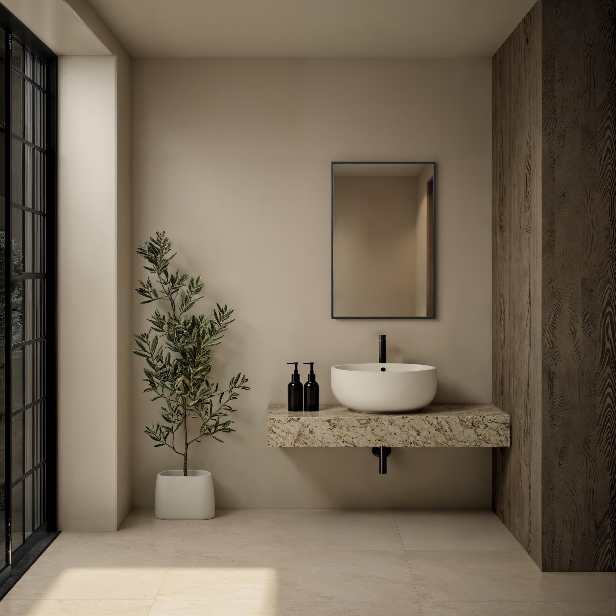Agata mirror displayed in a modern bathroom setting above a stone sink.