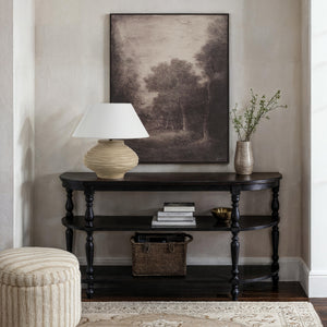 Falco canvas art featuring a serene landscape with trees in muted tones, framed and displayed above a console table.