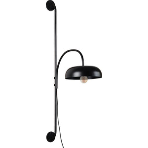 Draco Wall Sconce in black with a curved arm and dome shade, showcasing a vintage bulb.