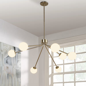 Mundo Ceiling Fixture with illuminated white globes, gold finish, modern design in a bright room.