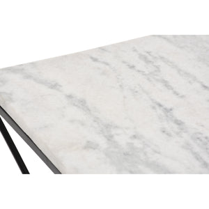 Close-up of SYMMETRY table's white marble top with gray veining