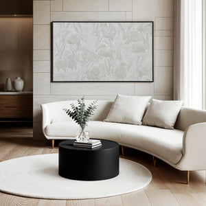 Lacey canvas art displayed in a modern living room above a white curved sofa.