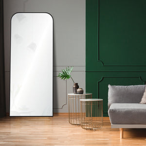 Mandret mirror by Renwil, positioned in a modern living room, black frame, reflecting interior decor.