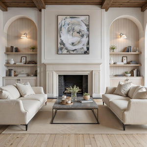 Ceiba canvas art featuring abstract design in muted colors, framed, displayed above a modern living room fireplace.
