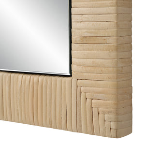 Close-up of Tally Wall Mirror's textured woven frame and reflective surface