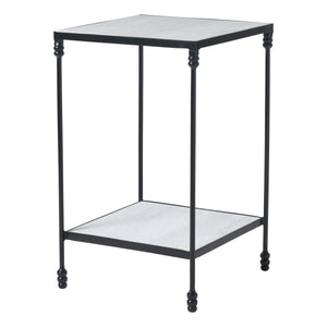 Giulia table with a black metal frame and gray stone top, featuring decorative legs.