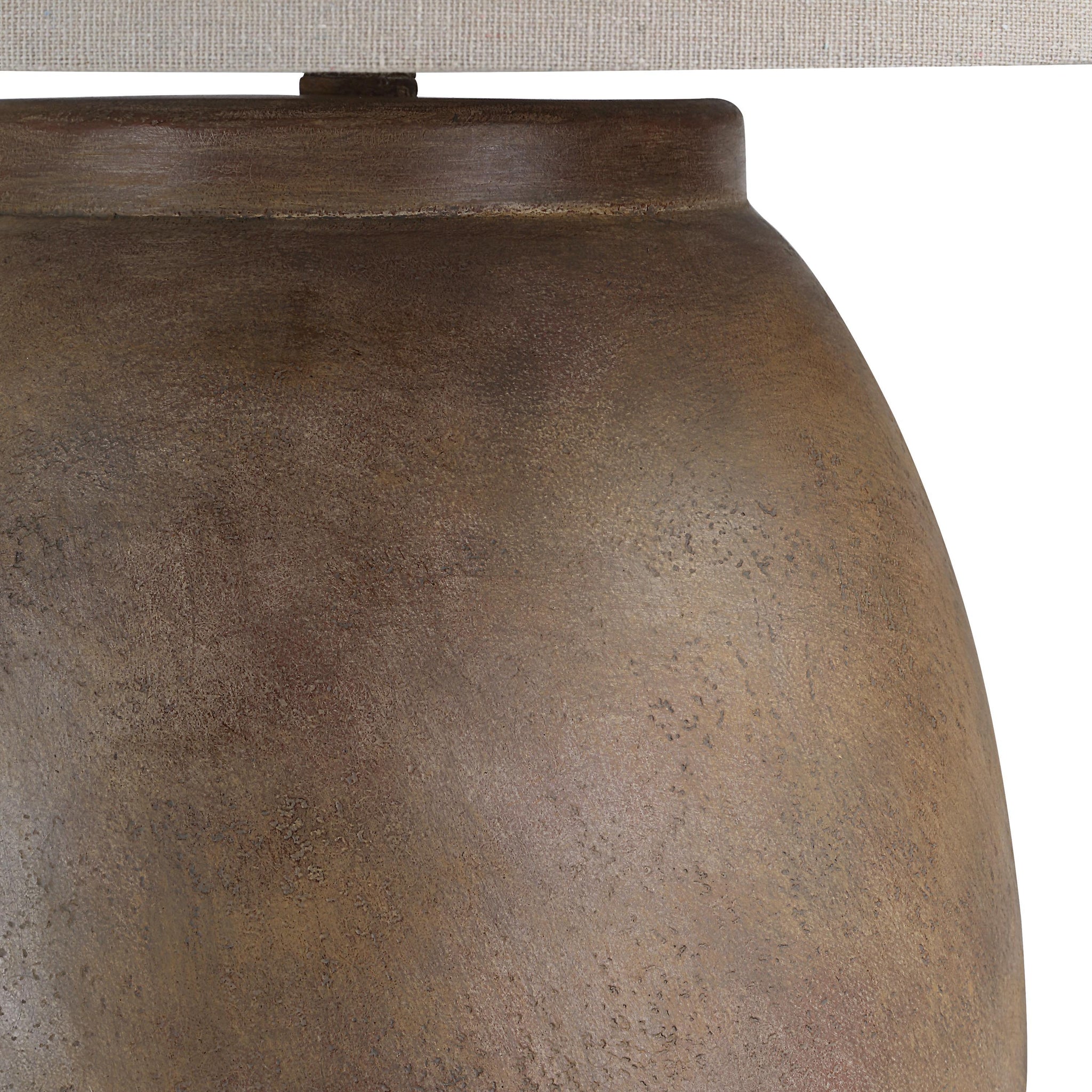 Close-up of Naima Table Lamp showing the textured brown ceramic finish