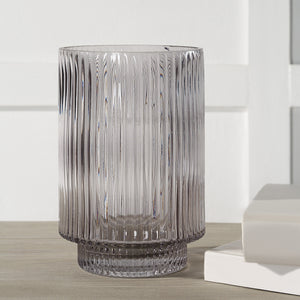 Amiens Indoor Mouth Blown Glass Vase in grey, fluted design displayed on a wooden surface.