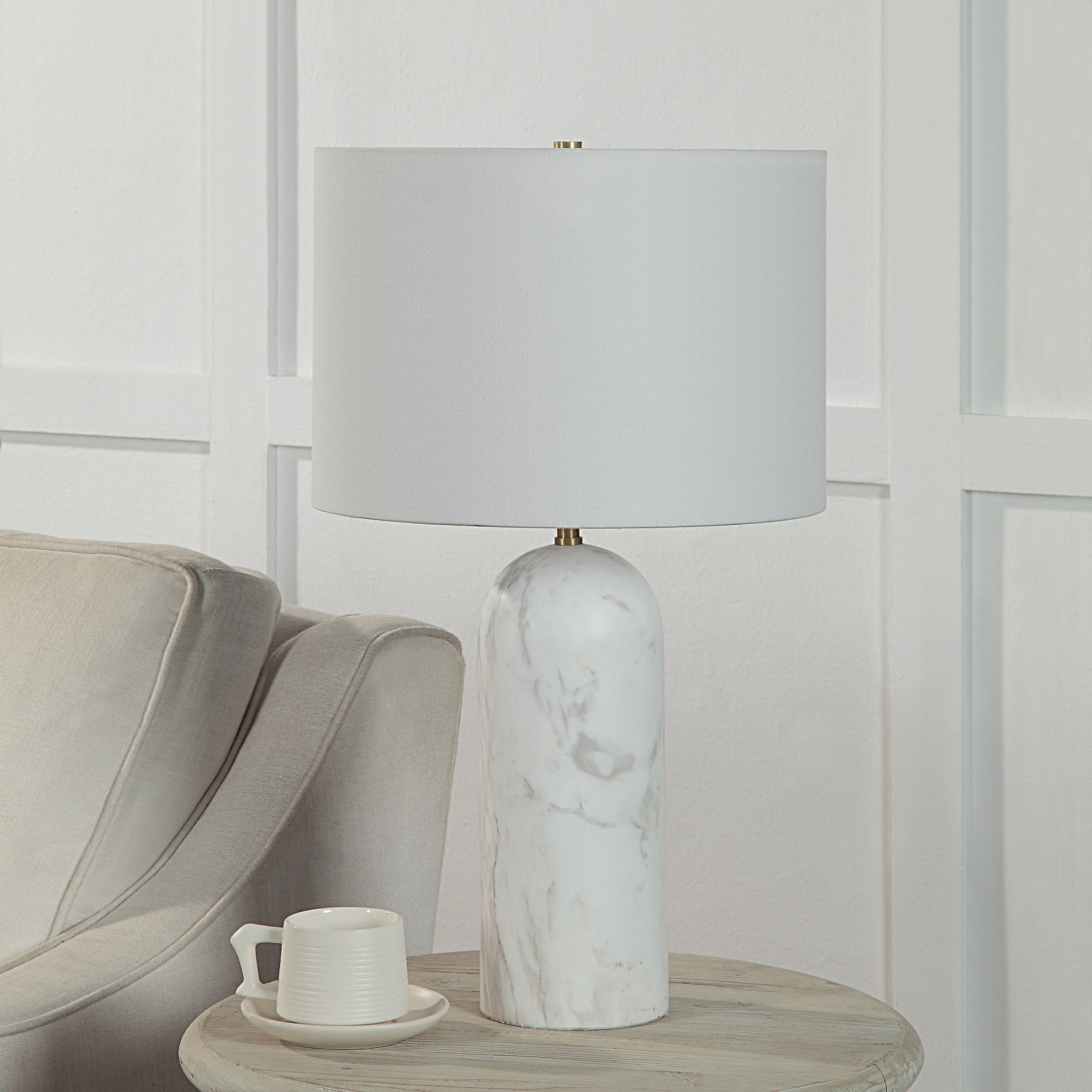 Beausoleil Table Lamp on a side table next to a beige armchair and a cup
