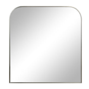 Salma mirror with a rounded top, sleek silver frame, and reflective surface