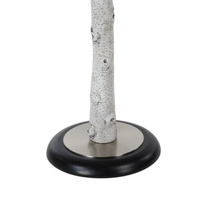Close-up of Criterion floor lamp base showing white branch texture and black circular base