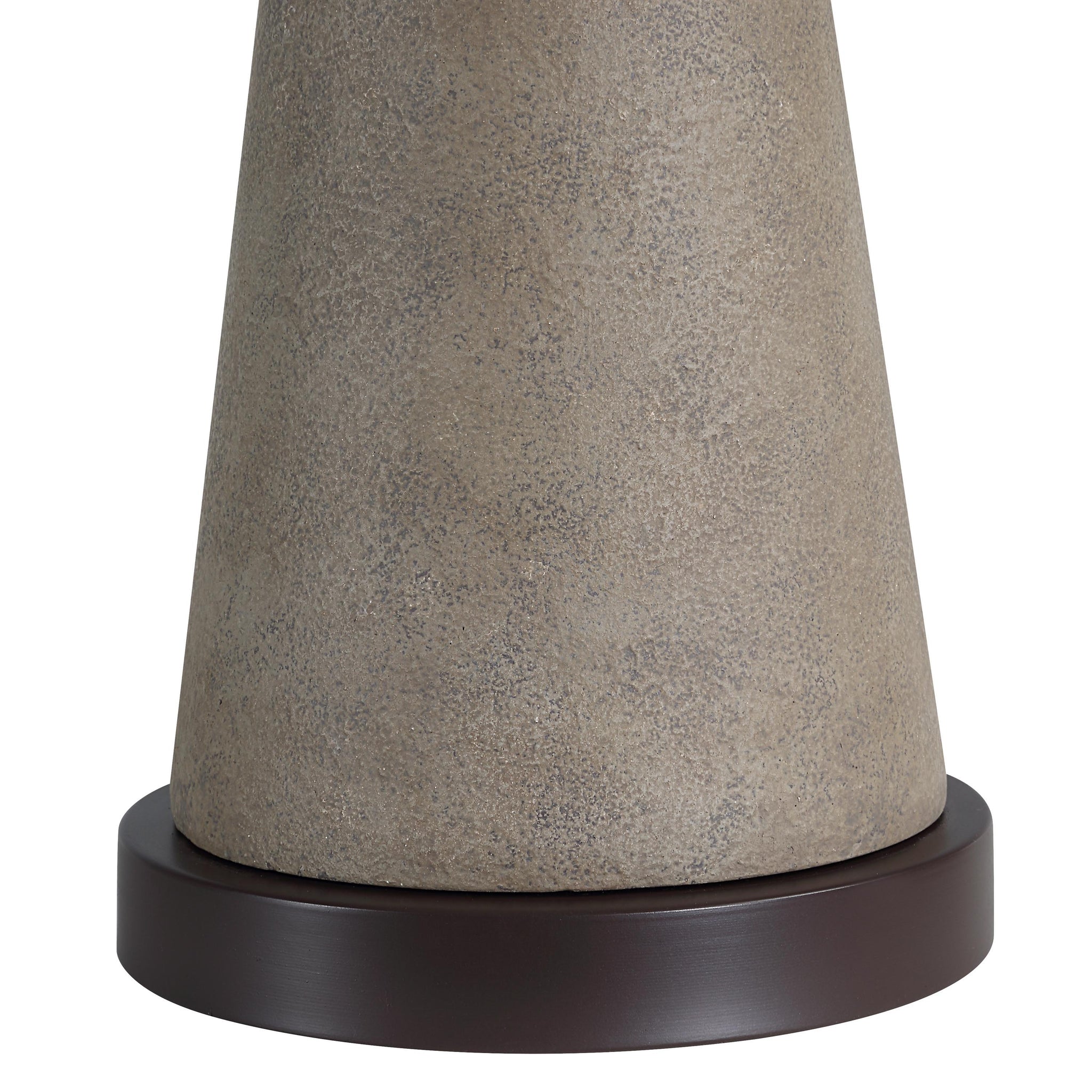 Close-up of Lourdes Table Lamp's gray textured base and dark circular base.