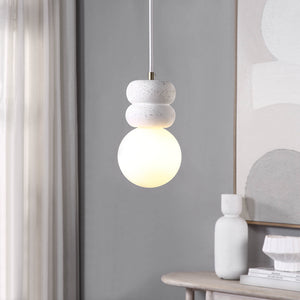 Candra Ceiling Fixture in a modern interior, showcasing a warm light globe and textured white ceramic design.