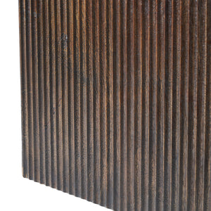 Tristan stool with a dark wood finish featuring vertical grooves.
