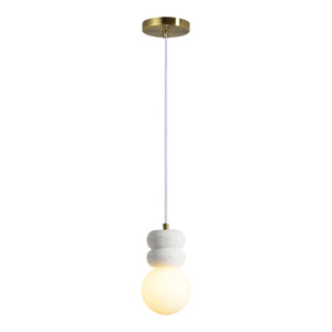 Candra Ceiling Fixture featuring a warm glowing glass globe and white ceramic details, suspended from a brass ceiling mount.