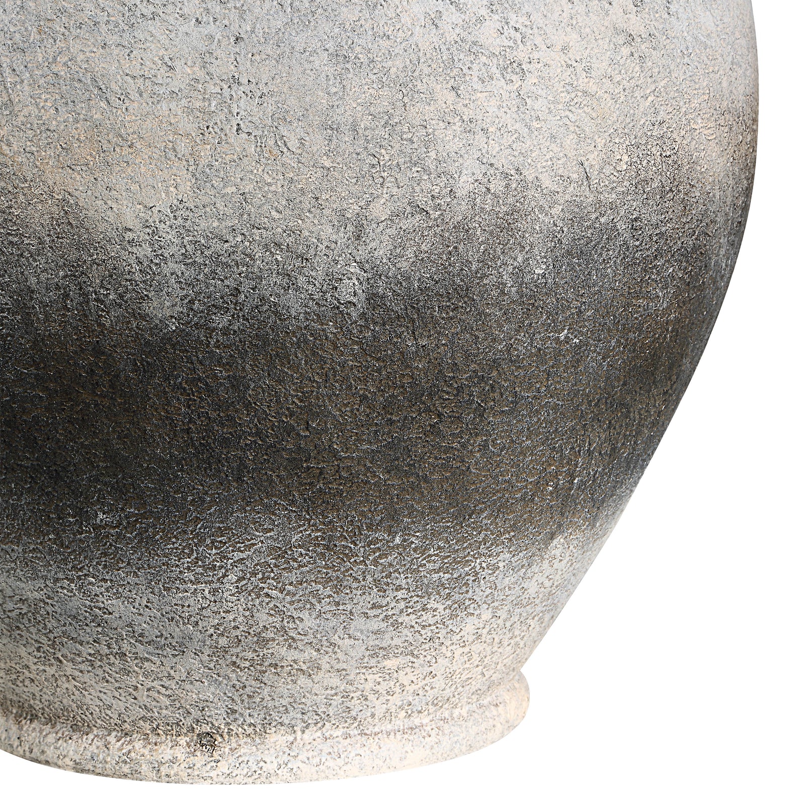 Betulla Table Lamp with a textured gray ceramic base and white fabric shade.